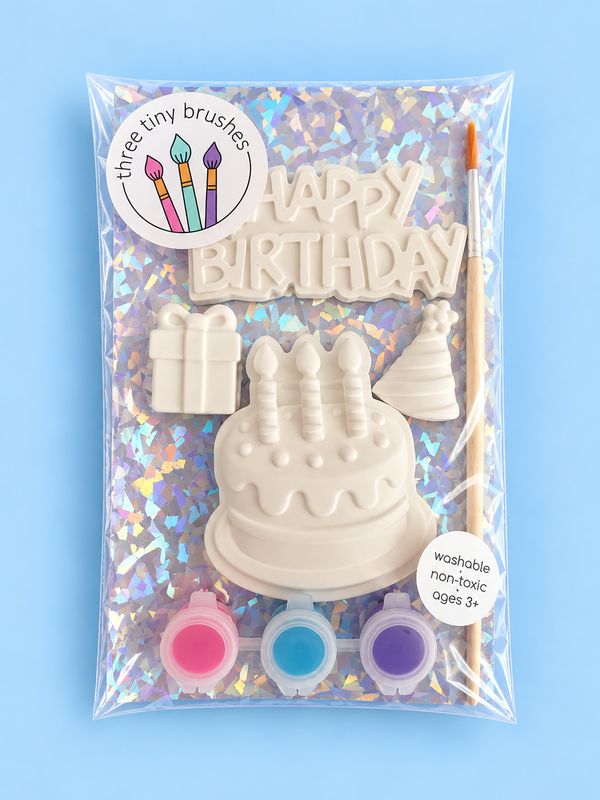 Happy Birthday party pack: a paintable cake, present, party hat and &ldquo;Happy Birthday&rdquo; plaque with three paint pots and a brush